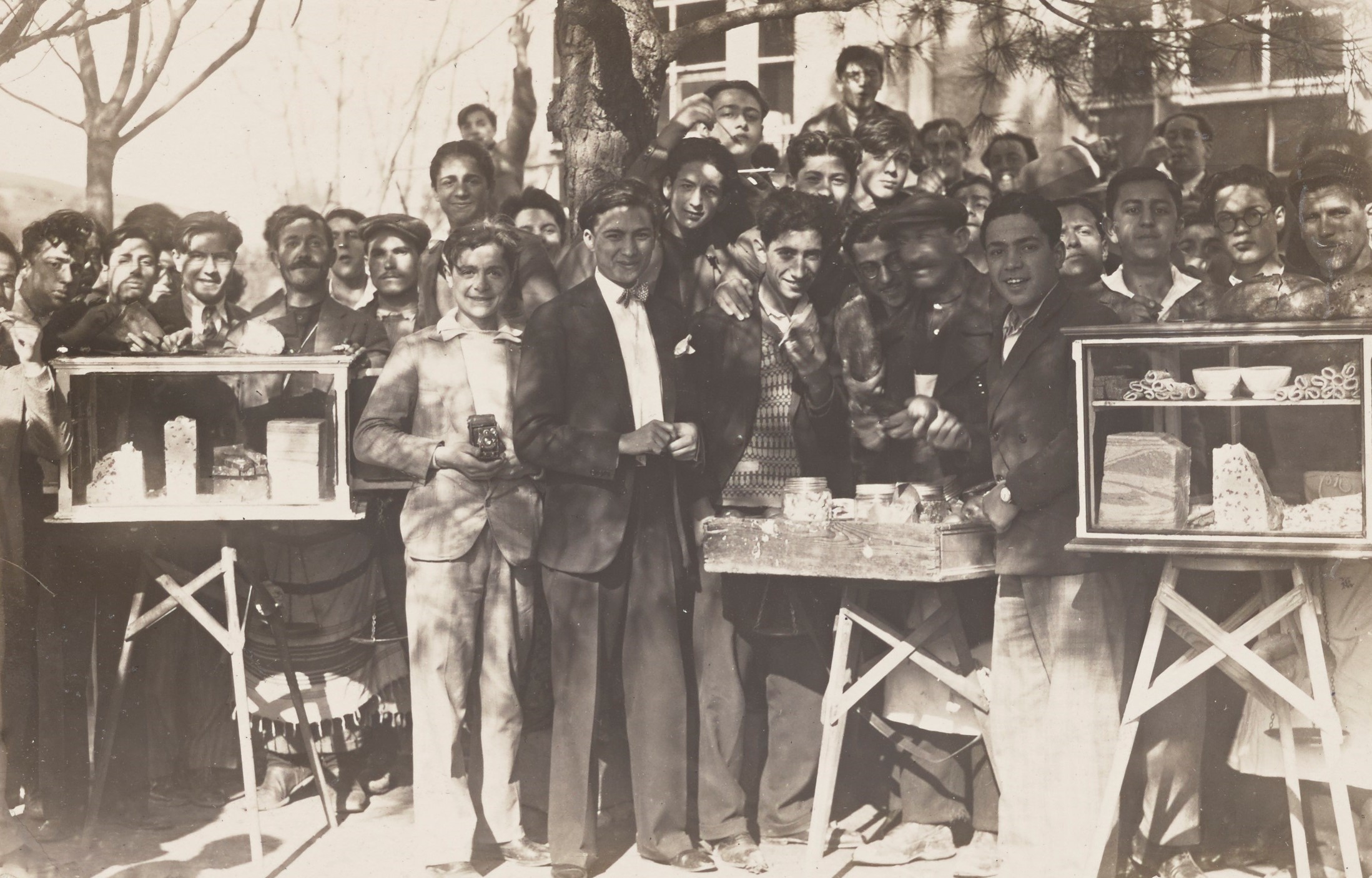 Robert College students together with street vendors at the land of sweets, 1929-1930. CU-RBML, RC Documents